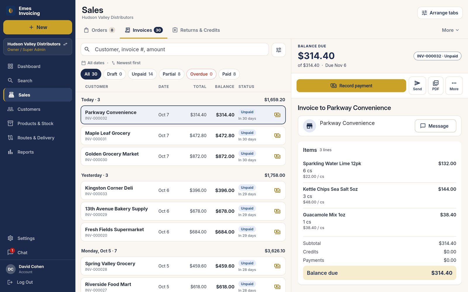 Emes Invoicing on a laptop: the Sales list with an open invoice, its lines, totals and Record payment